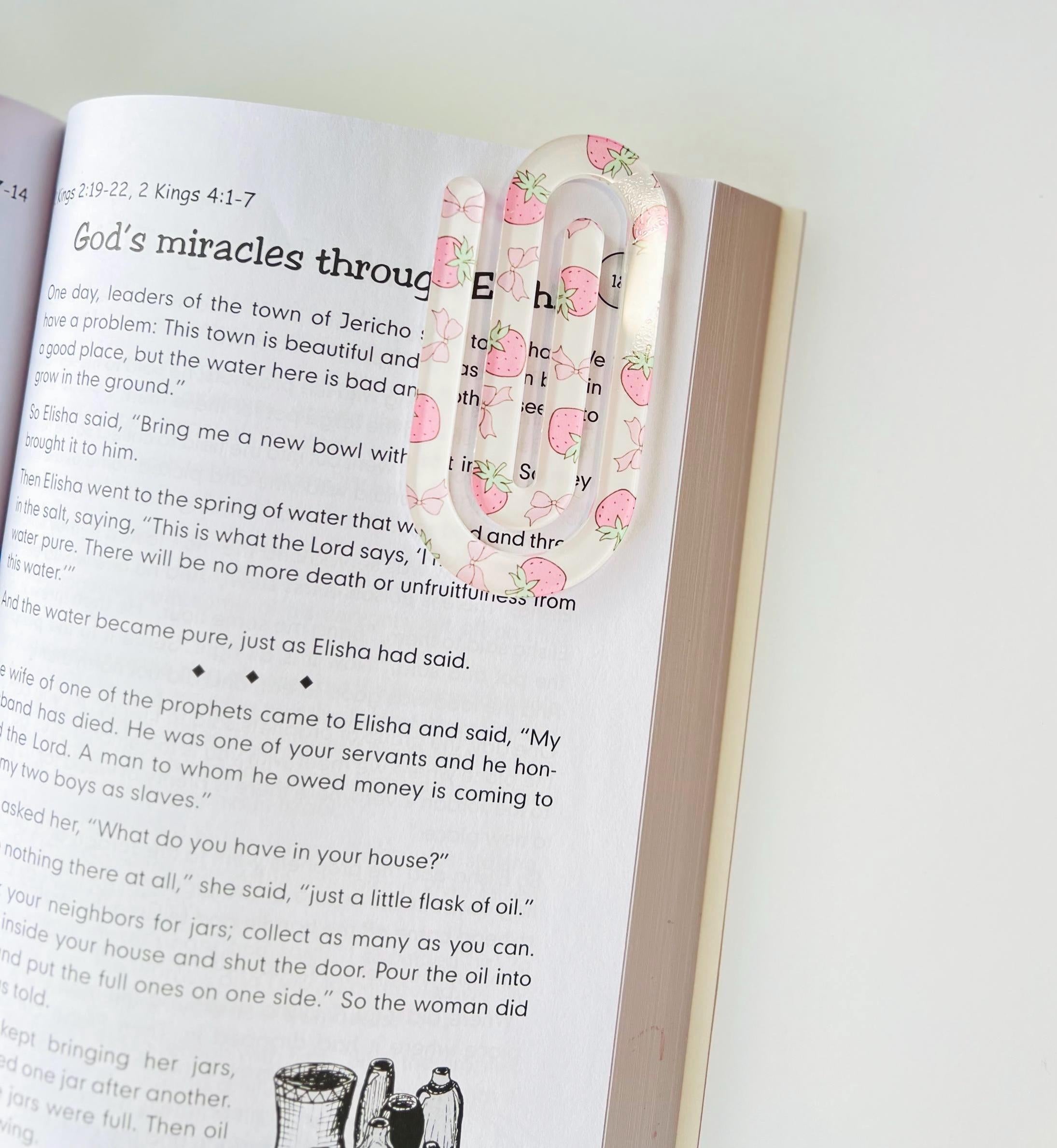 Strawberry Acrylic Bookmark - pattern clipped onto an open Bible at 2 Kings 4