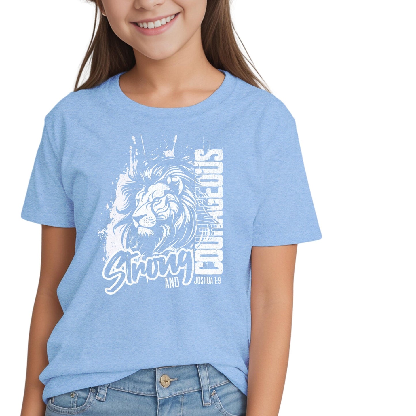 Smiling girl wearing a blue Christian t-shirt with a lion graphic and ‘Be Strong and Courageous’ text from Joshua 1:9.