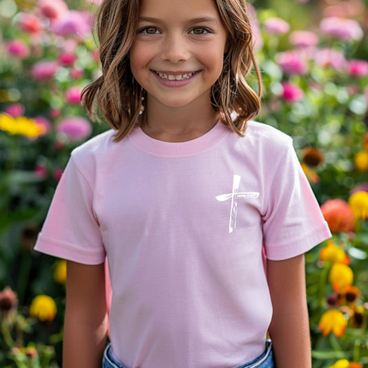 Girl wearing Pink John 3:16 Kids T-Shirt , one with a white cross on the front and the other with the John 3:16 Bible verse on the back; more colors available