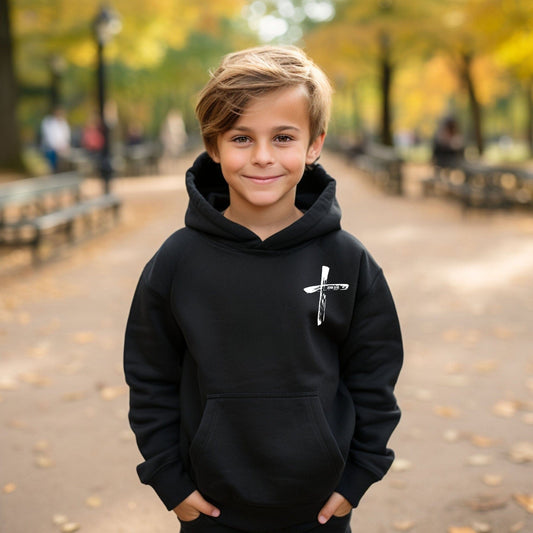 A boy wearing a kids hoodie featuring a white cross design on the chest and John 3:16 scripture printed on the sleeve.