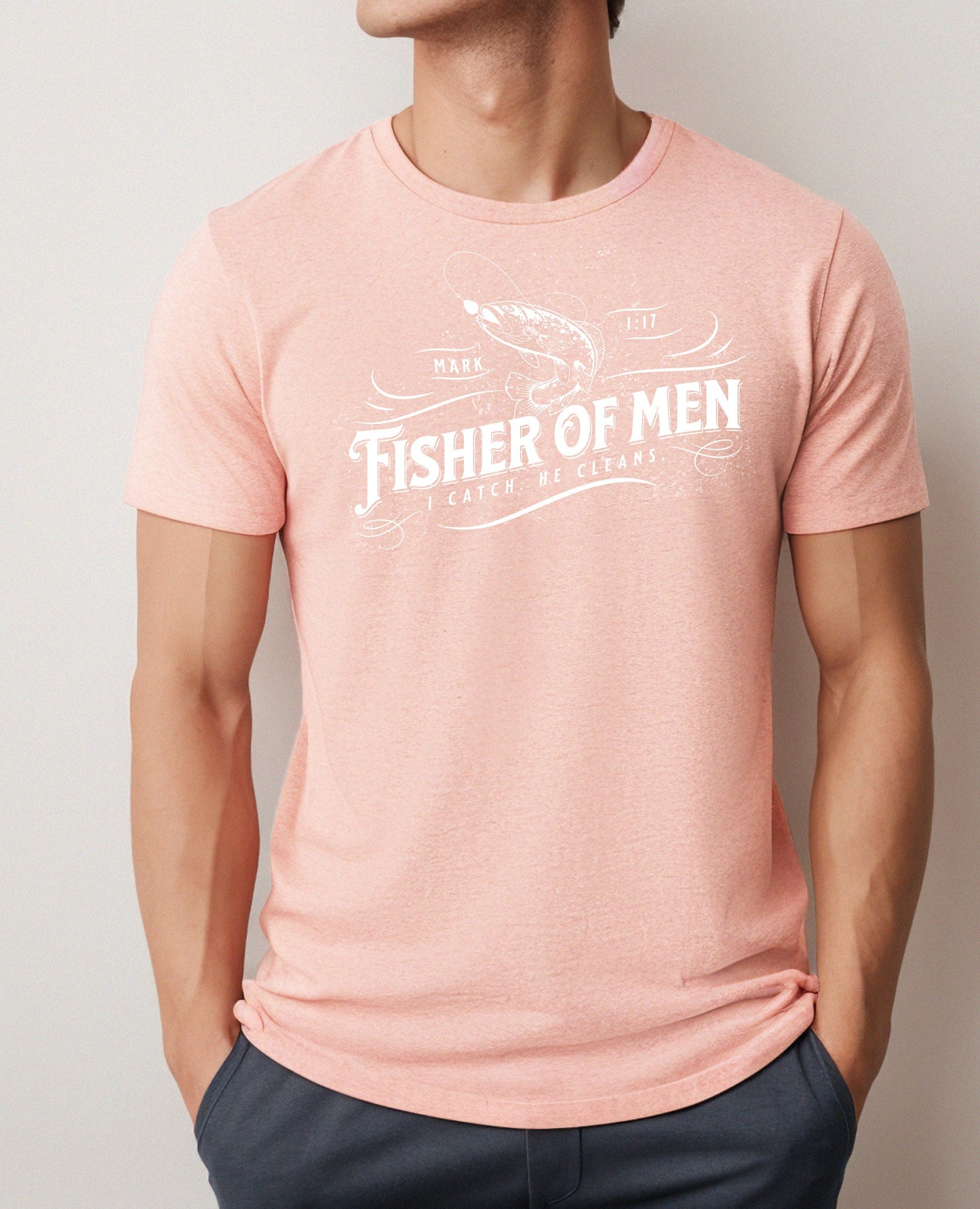 Man wearing a Heather Sunset Fisher of Men t-shirt with a fish graphic and the phrase Fisher of Men, Mark 1:17, with the quote I catch. He cleans.