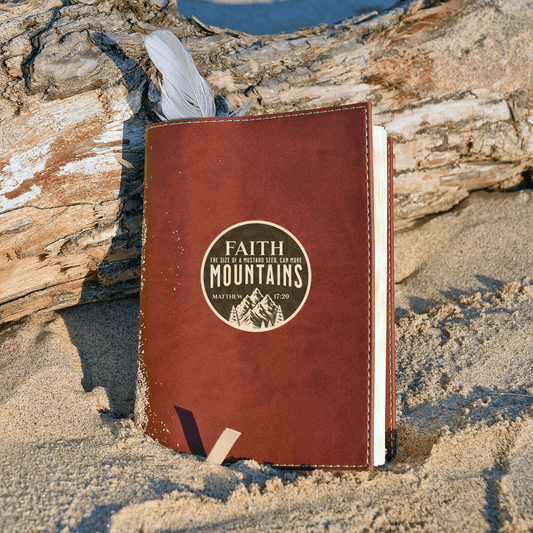 Faith Can Move Mountains waterproof sticker with Matthew 17:20 on a leather notebook