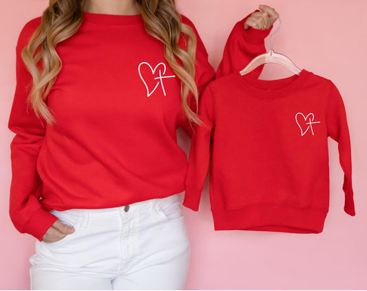 Matching red Heart of Faith Christian Sweatshirt design for mom and child, perfect faith-based Valentine’s Day gift or family outfit.
