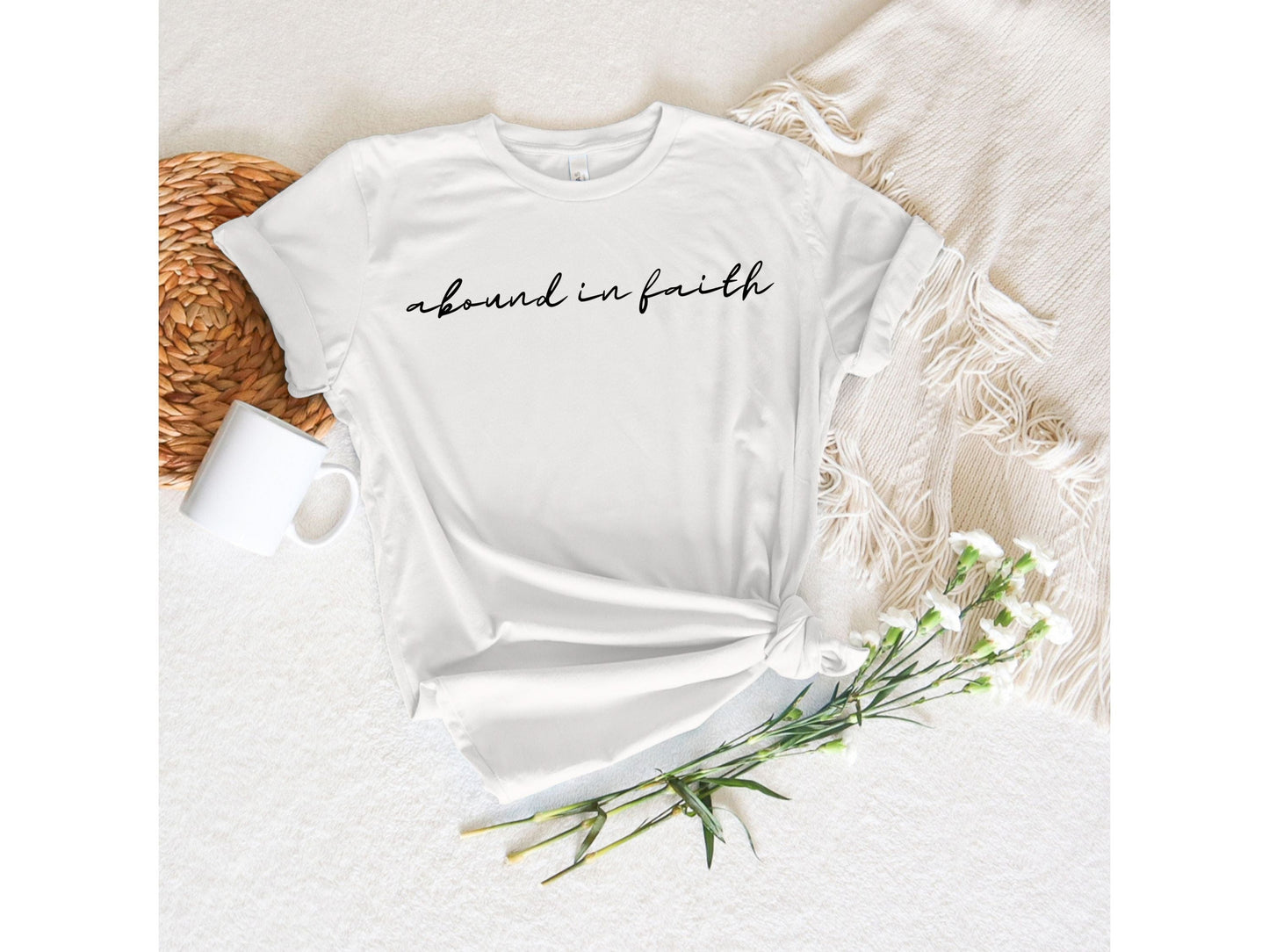Minimalist Christian women’s t-shirt Abound in Faith in black script font