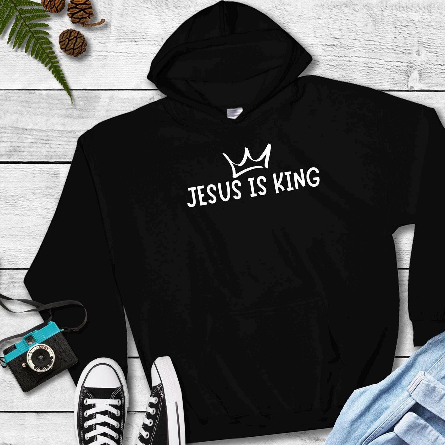 Empower kids to share their faith with our 'Jesus Is King' Youth Hoodie – available in black hoodie or crewneck style.