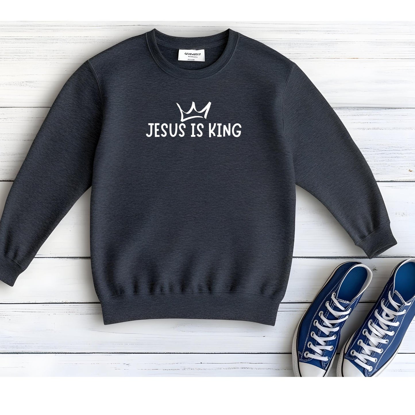 Empower kids to share their faith with our Jesus Is King Youth Hoodie in Dark Grey