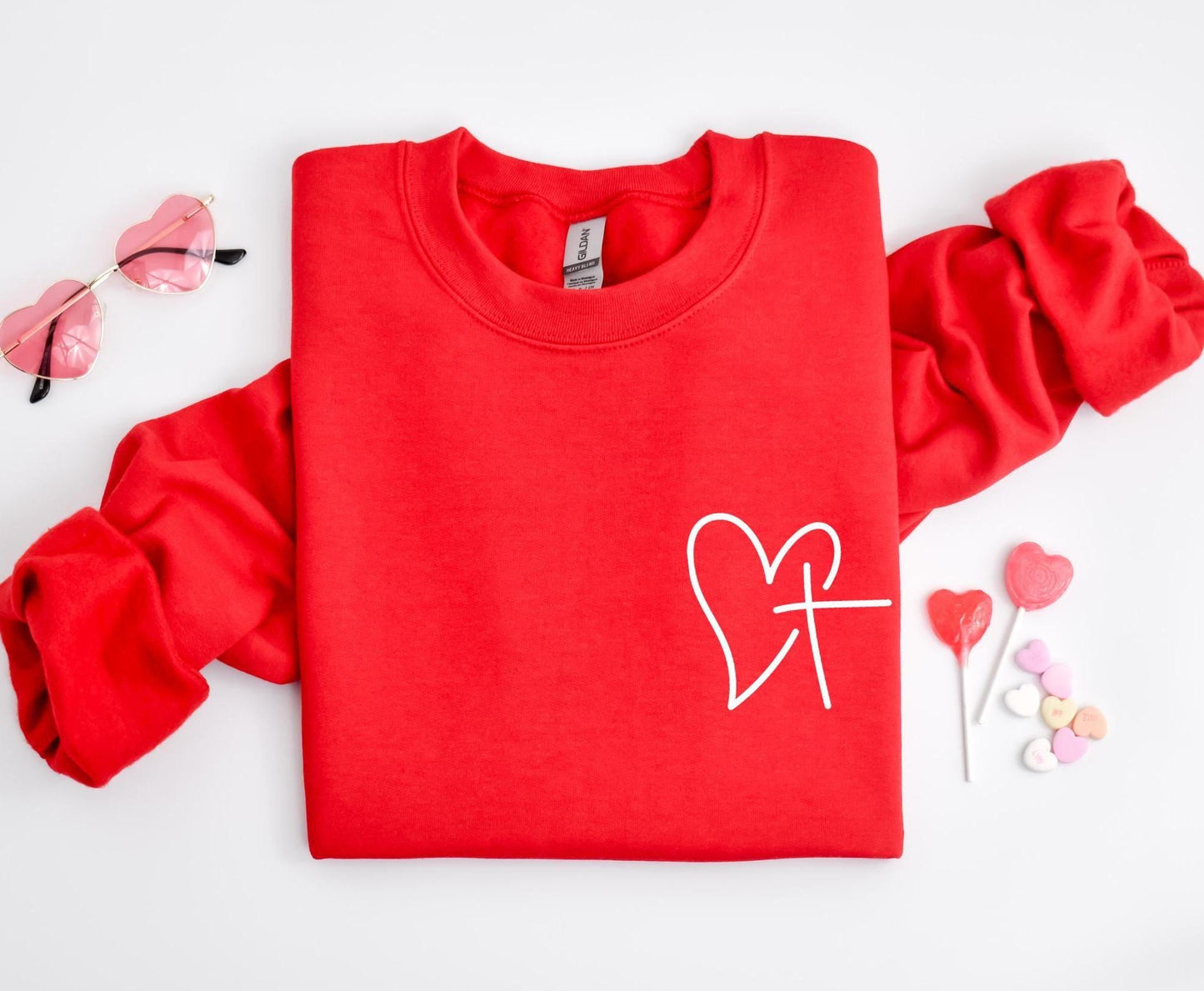 Celebrate Valentine's Day with our Heart and Cross Sweatshirt – a perfect blend of love and faith!