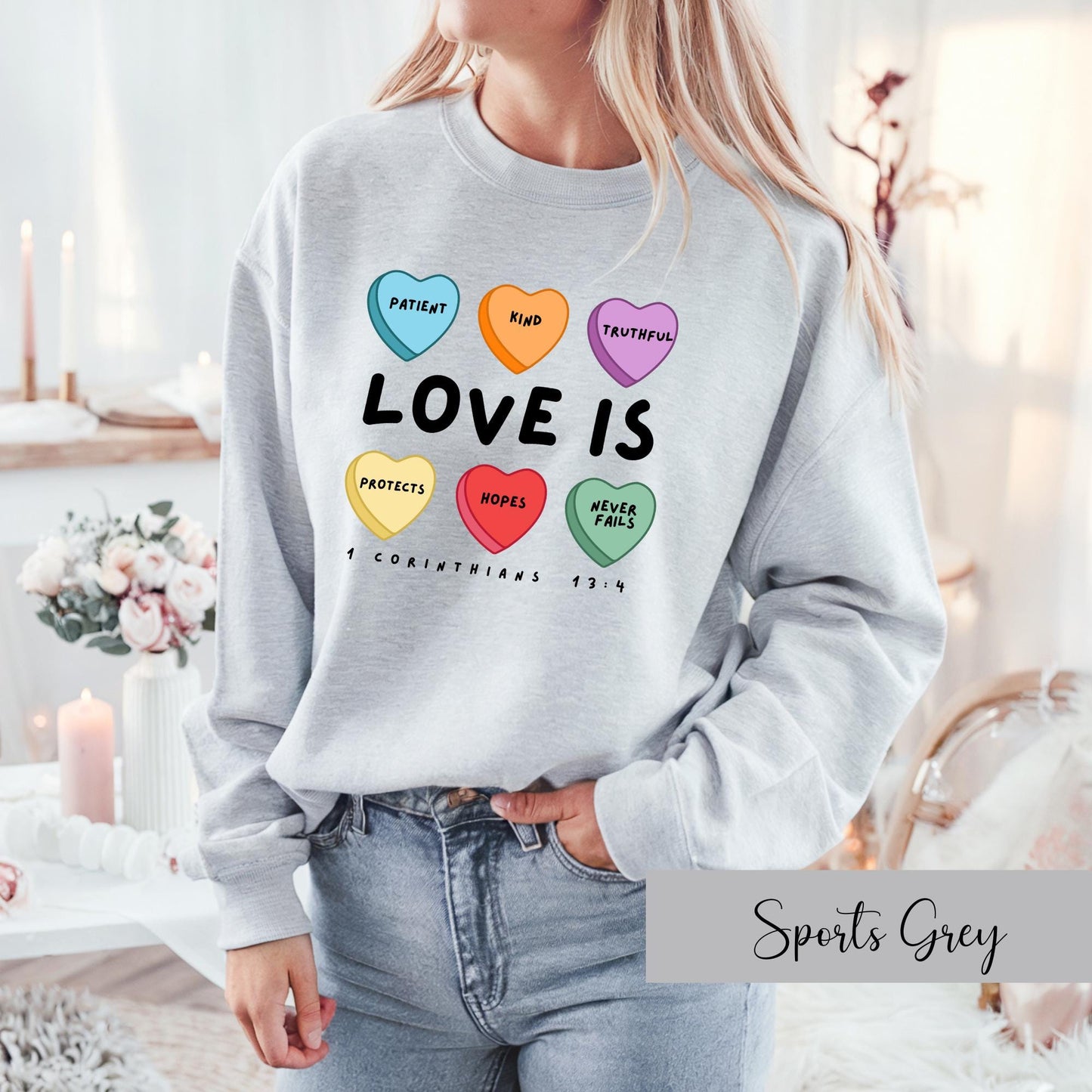 Celebrate love and faith with our Candy Hearts 1 Corinthians 13 Valentine's Day Sweatshirt! Perfect for cozy winter days. Sport Grey Sweatshirt