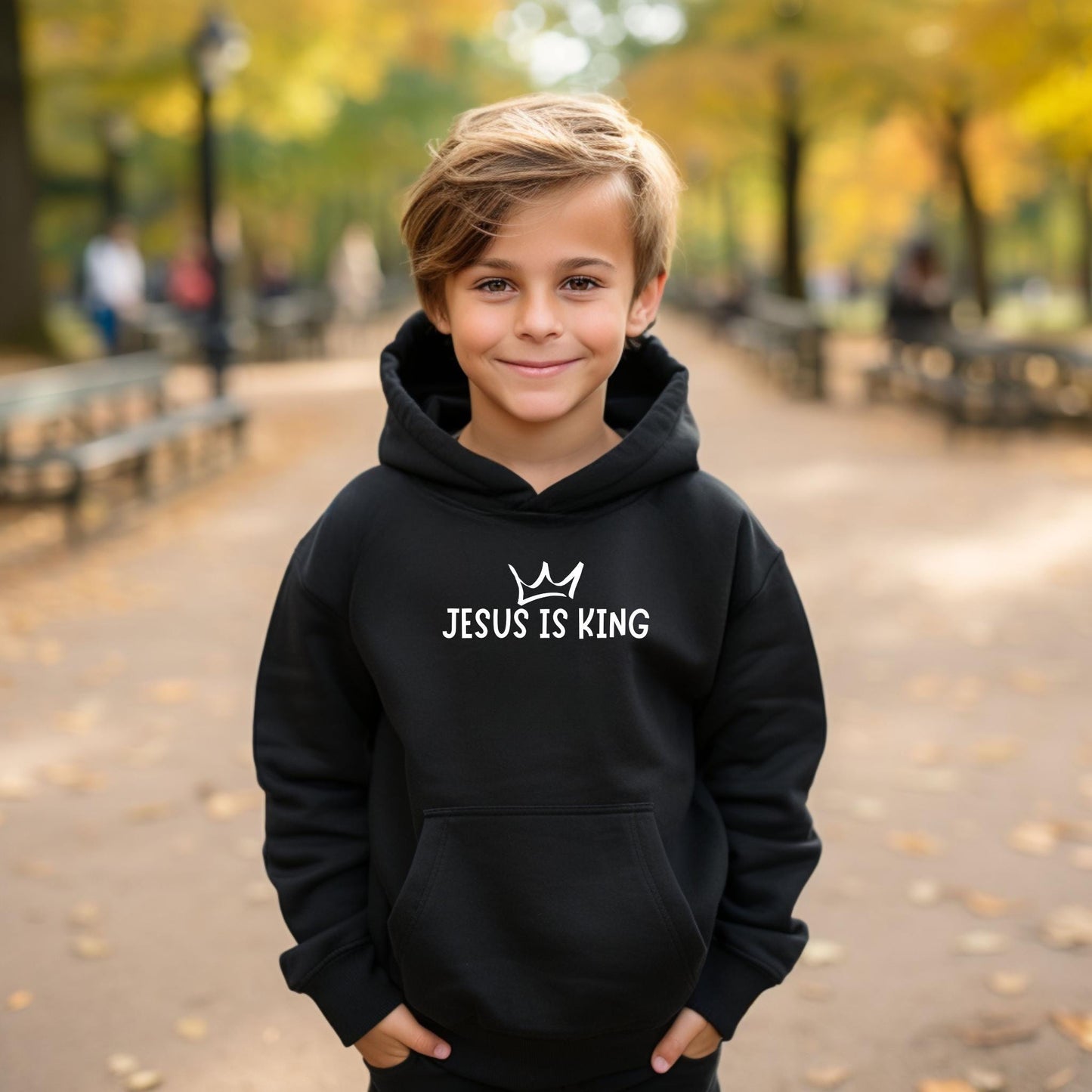 Empower kids to share their faith with our 'Jesus Is King' Youth Hoodie – available in black hoodie or crewneck style.