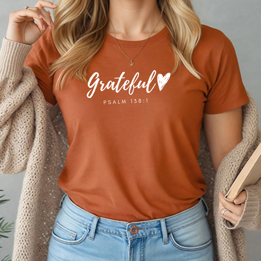 Grateful Heart” Christian t-shirt in fall colors (mustard, mauve, heather brown, maroon, and black) featuring Psalm 138:1 design, ideal for faith-based fall fashion