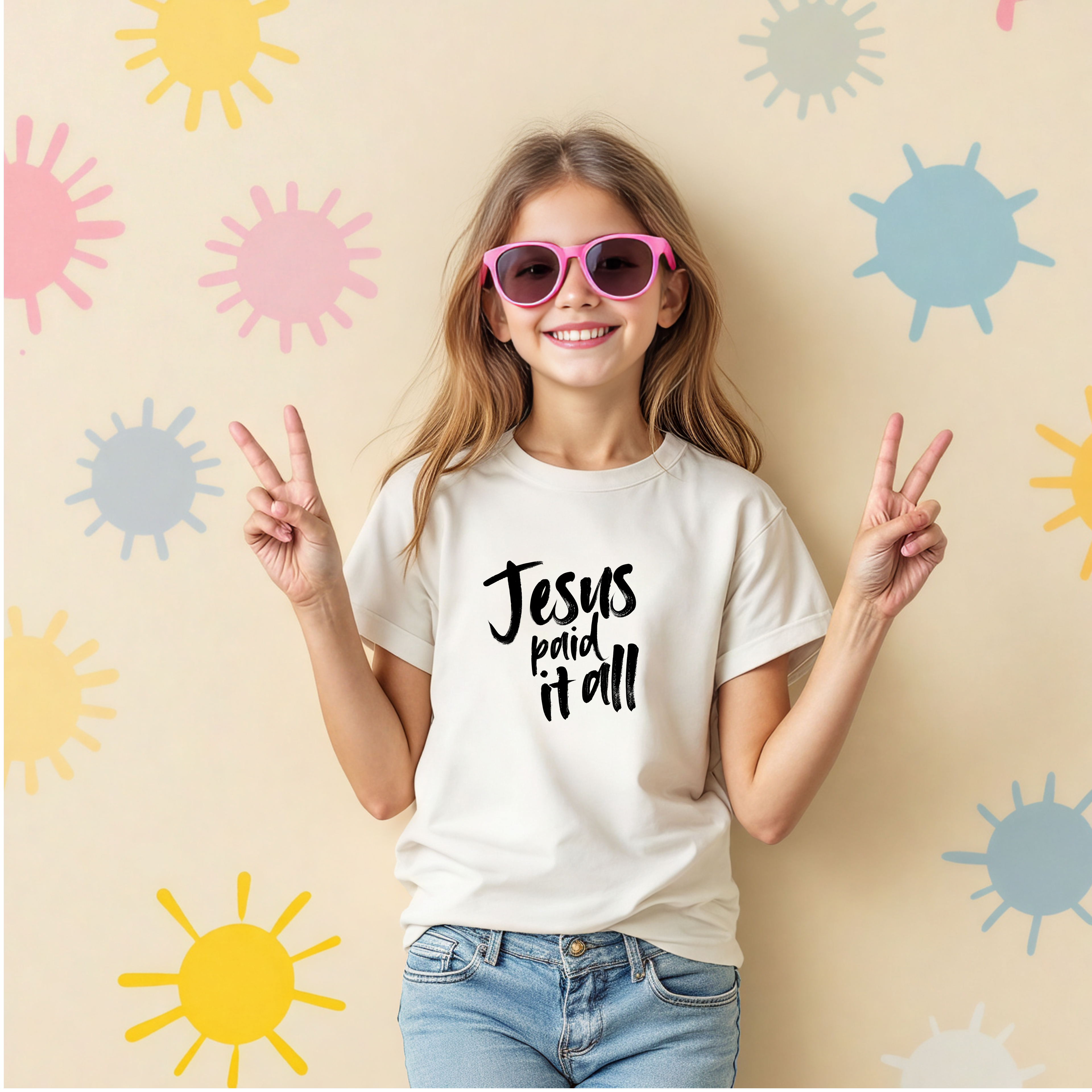 Girl giving peace sign wearing Jesus Paid It All youth Christian t-shirt by Abound in Faith