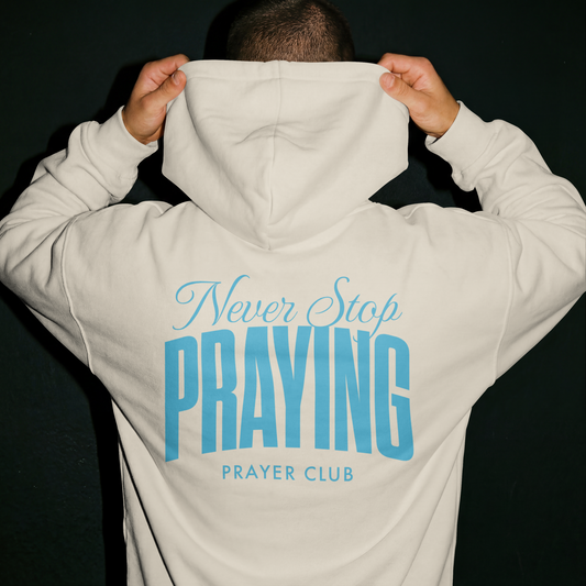 Never Stop Praying hoodie back blue ink Bone - Abound in Faith