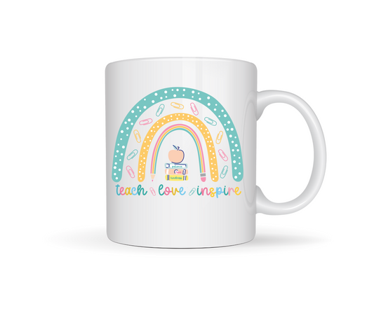Teach love inspire teacher mug  White ceramic mug with a colorful rainbow design and text on a white background