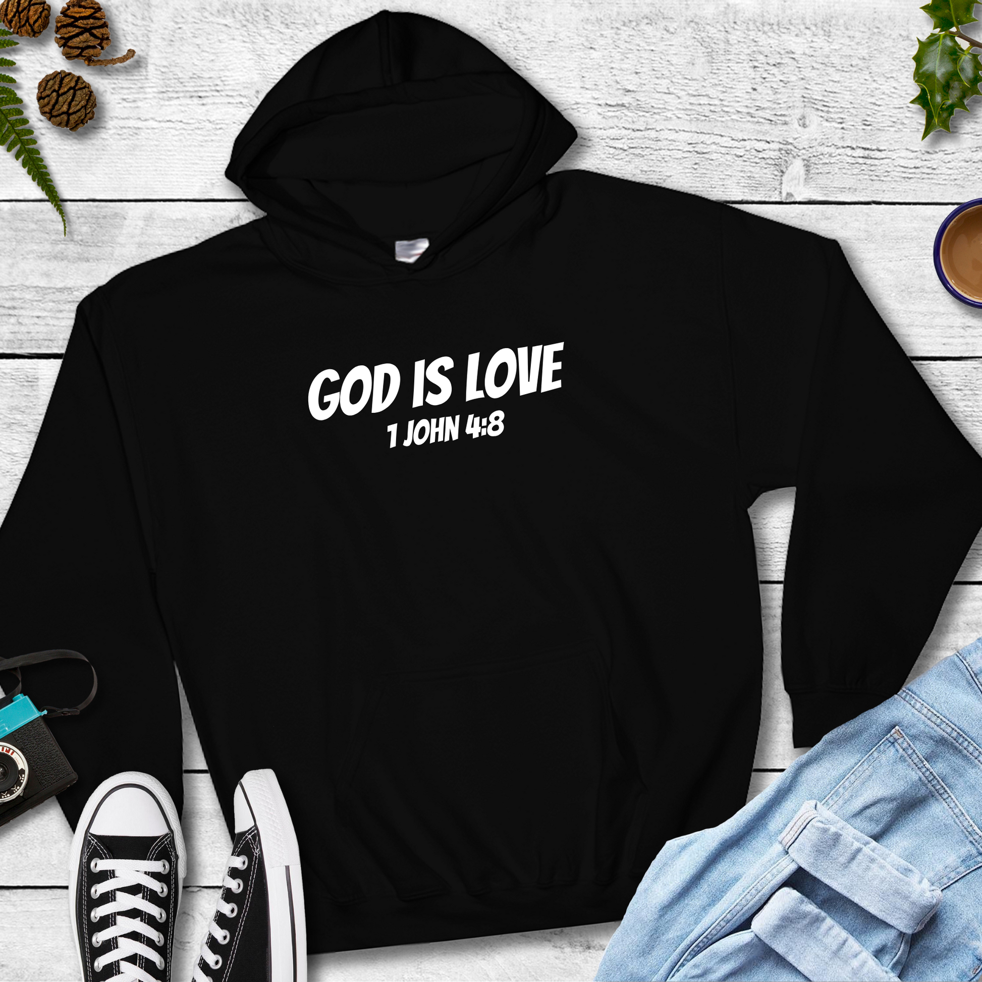 Black kids’ Christian hoodie with God Is Love kids hoodie  Bible verse printed in white text.