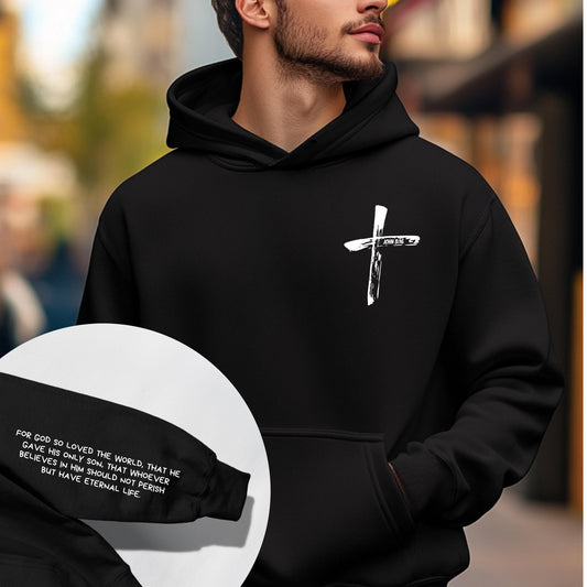 John 3:16 Hoodie - men wearing a black hoodie with a cross in the front and full bible verse on the sleeve