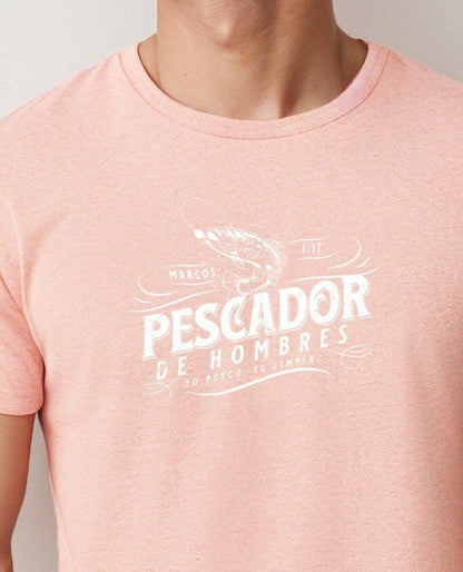 Man wearing Heather Sunset Christian t-shirt with ‘Pescador de Hombres’ design in Spanish, inspired by Mark 1:17 with a fishing hook graphic.