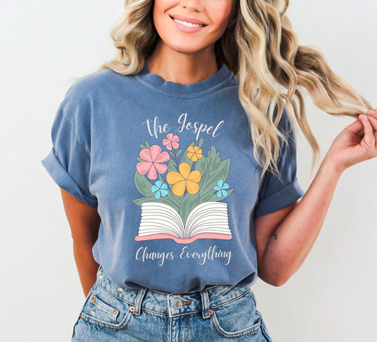 Christian shirt with floral bouquet and “Gospel changes everything shirt. design on blue Comfort Colors tee