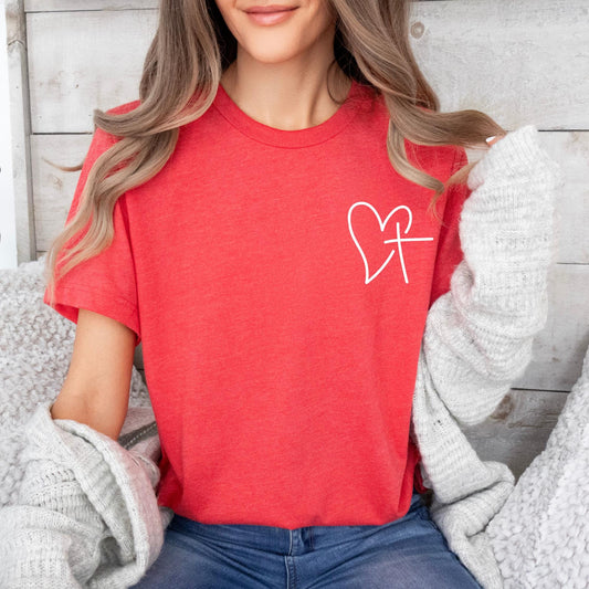 Heart and Cross Shirt design, worn by a woman, styled with romantic Valentine’s decor – a perfect faith-based gift for women.