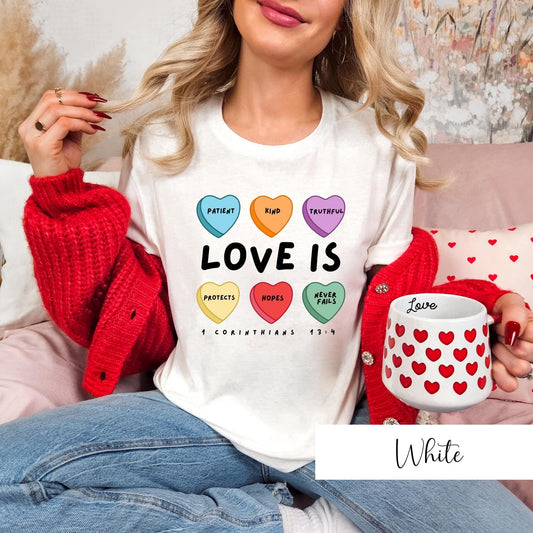 White Christian t-shirt for women with Love Is conversation hearts design based on 1 Corinthians 13:4 scripture