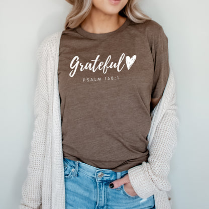 Grateful Heart” Christian t-shirt in fall colors (mustard, mauve, heather brown, burgundy, and black) with Psalm 138:1 verse design. Ideal for Thanksgiving and faith-based outfits.