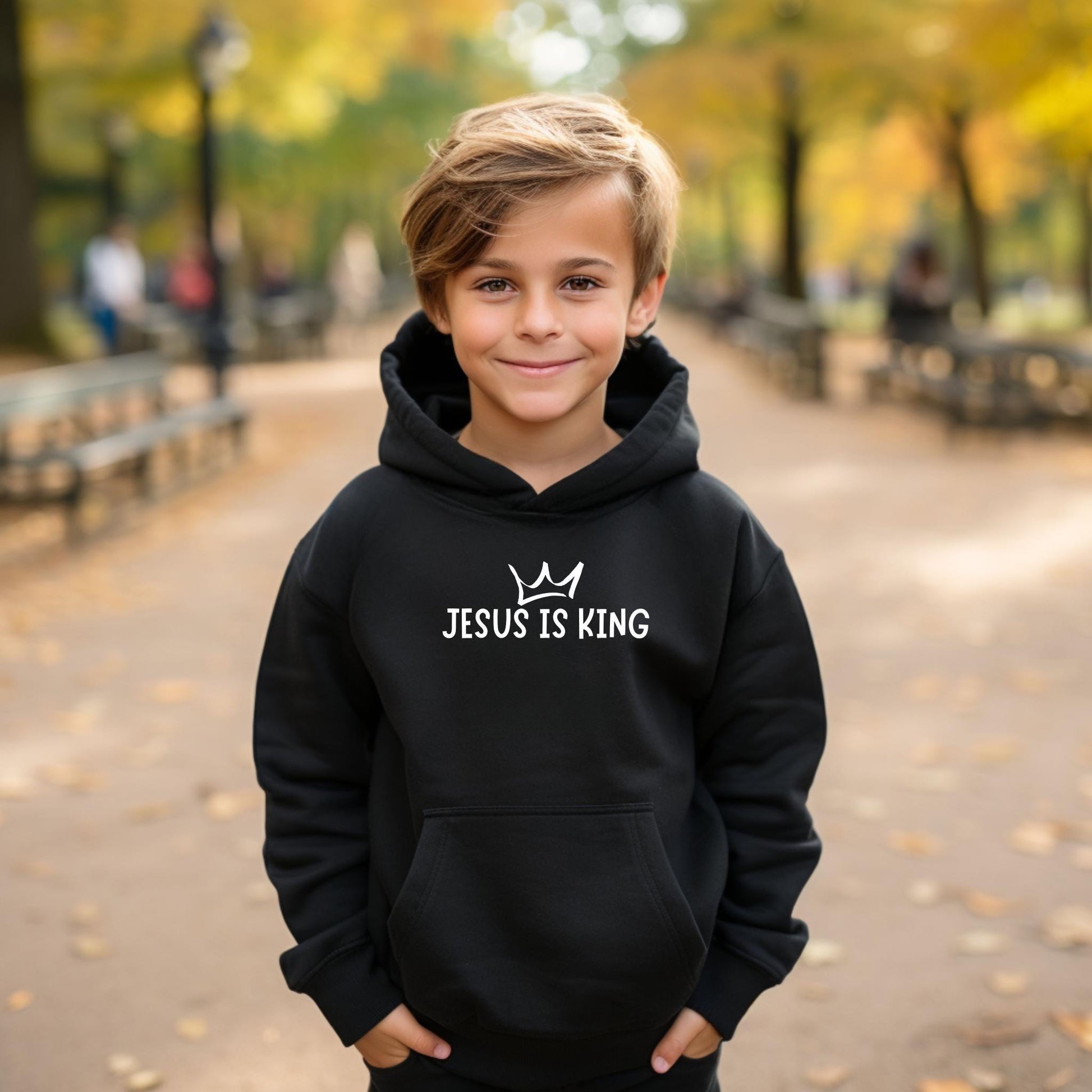 Empower kids to share their faith with our &#39;Jesus Is King&#39; Youth Hoodie – available in black hoodie or crewneck style.