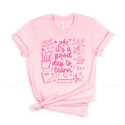 Pink t-shirt with pink text and graphics on a white background