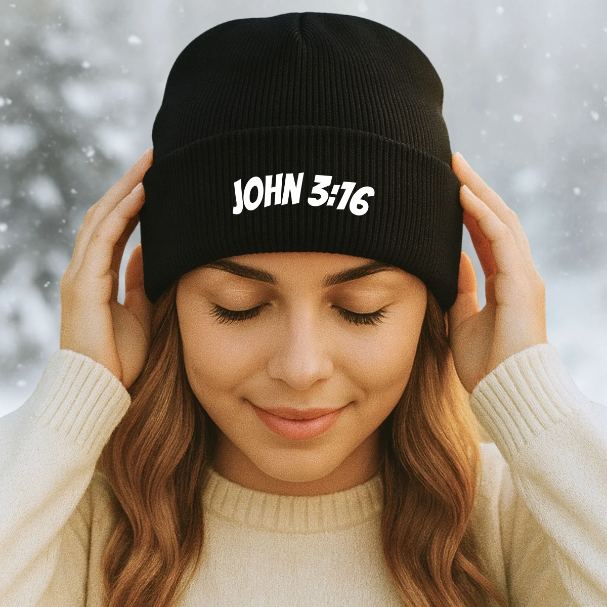 Woman wearing a black beanie with 'JOHN 3:16' text against a snowy background